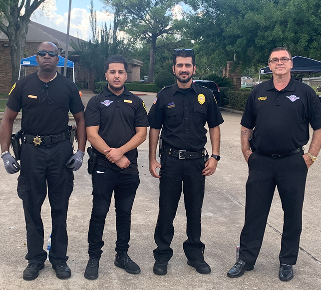 A group of four security guards in Houston Texas getting ready for an event.