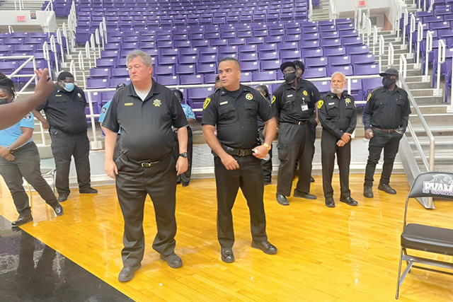 Group of Armed Security Guards on Gymnasium Floor